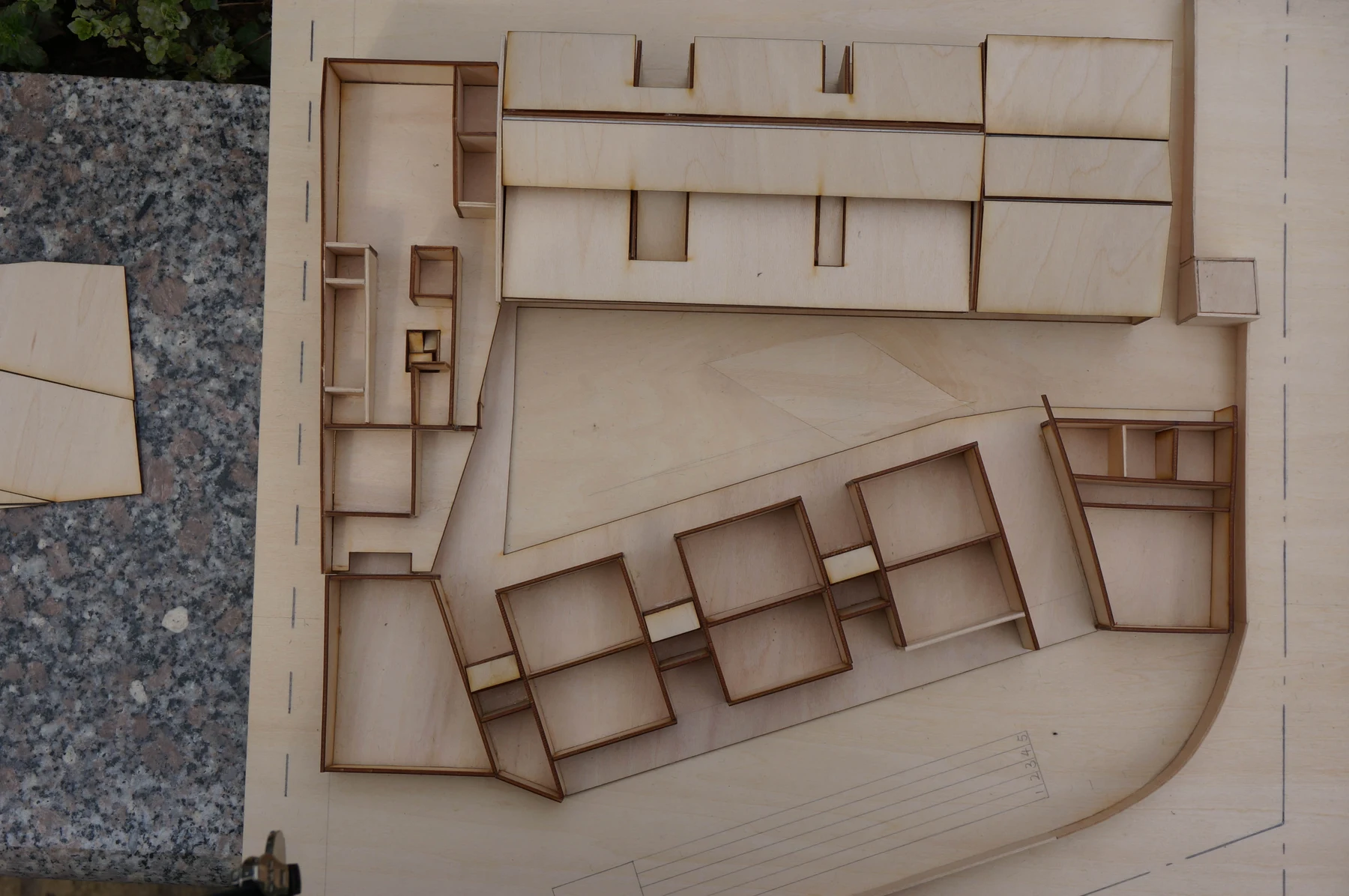 Overhead photograph of the model with part of the roof removed to reveal interior rooms