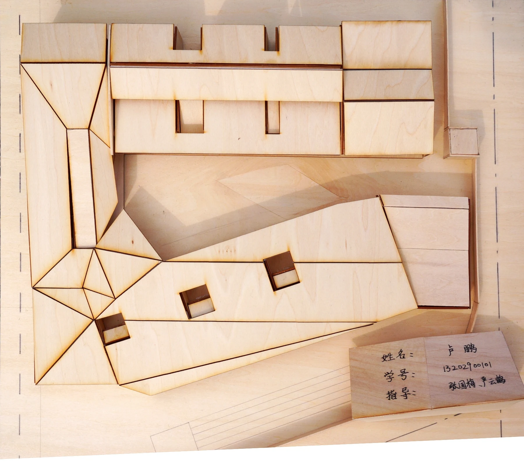 Overhead photograph showing the model roof composition and open central space