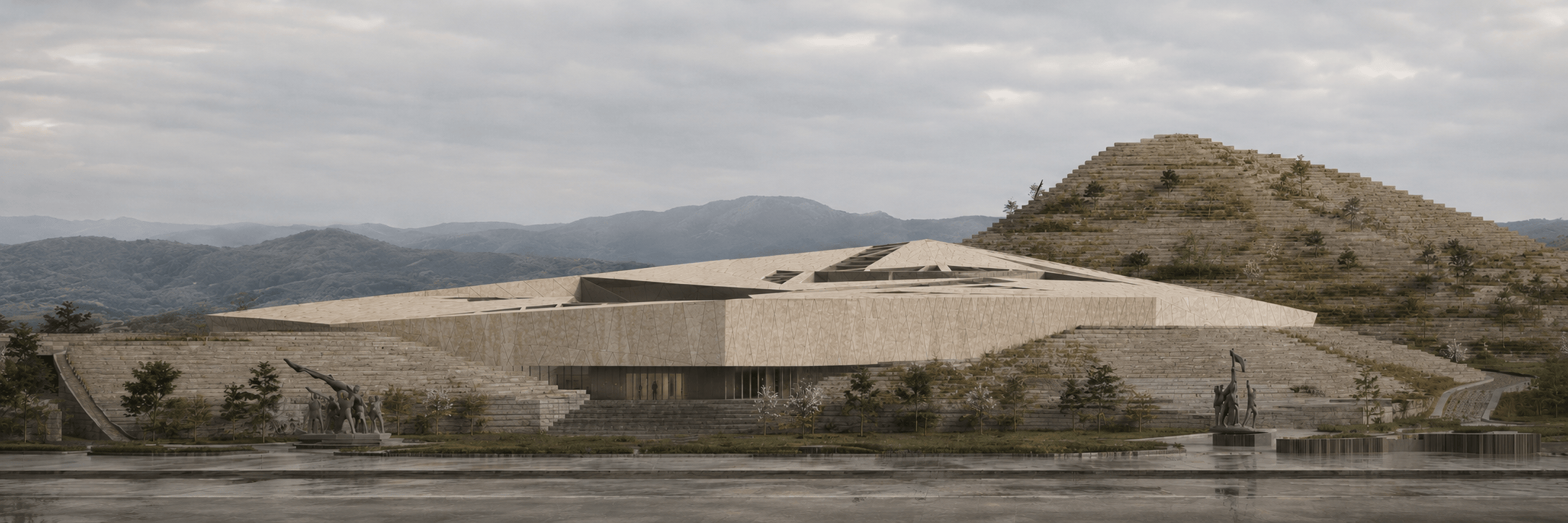 Museum arrival view showing the faceted stone body, glazed entrance, stepped landscape, and commemorative sculptures