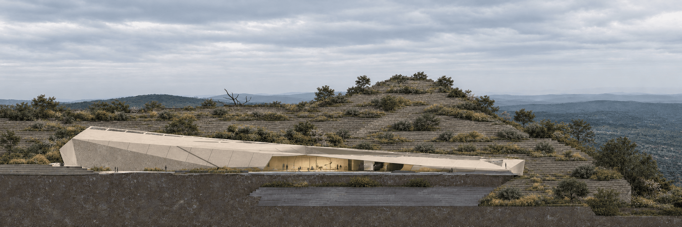 Low, folded museum facade set into a terraced hillside beneath an overcast sky