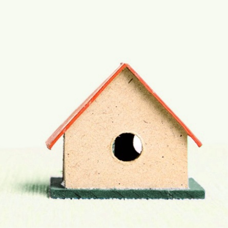 Small house-shaped reference object with a rectangular body and pitched roof, used in the original design portfolio